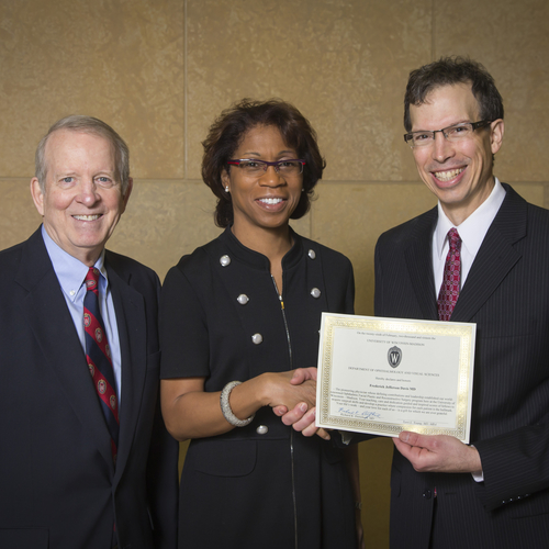 Dr. Lucarelli (right) receives the Dortzbach Professorship award from department chair Terri Young, MD, MBA (center) with Richard Dortzbach, MD (left).