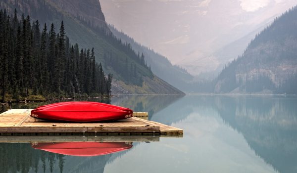 Red Canoes on a Scenic Lake