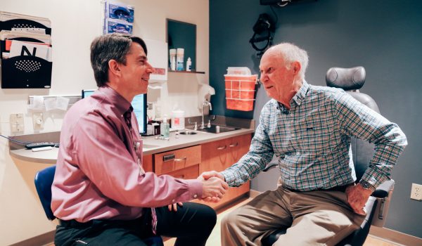 Doctor and Patient Shake Hands at UW DOVS Clinic