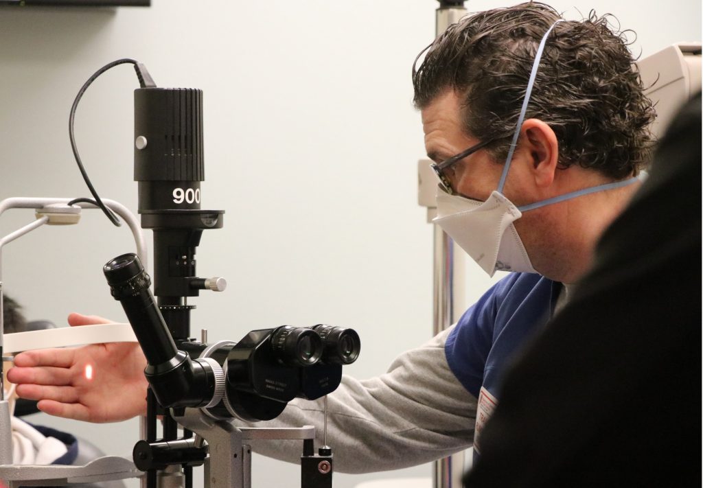 Ophthalmologist Travis Rumery demonstrates how the slit lamp works.