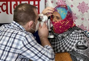 a doctor performs an eye exam on a patient