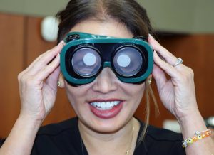 woman wearing green VR googles