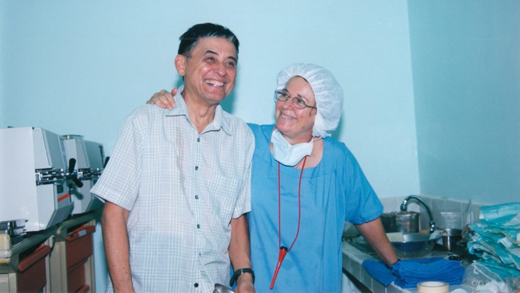 Dr. Guillermo de Venecia and his wife Marta, in surgical scrubs