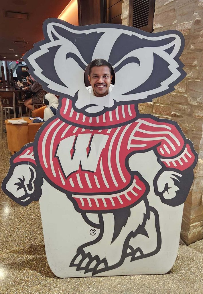 man's face in a Bucky Bader cut-out sign