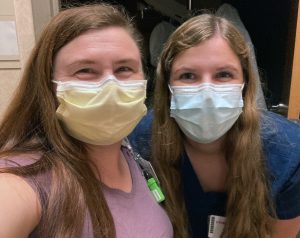 two women in surgical masks