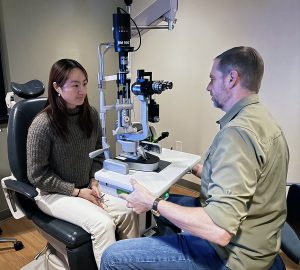 man and woman in eye doctor office