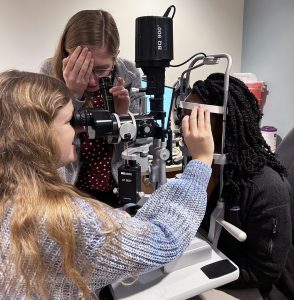 woman examines eyrd