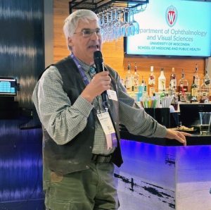 Dr. Andrew T. Thliveris giving a speech