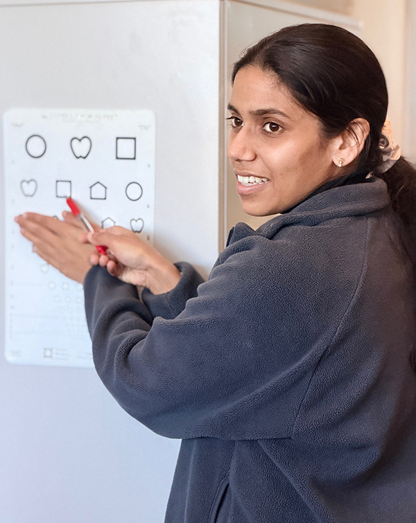 woman pointing to an eye chart