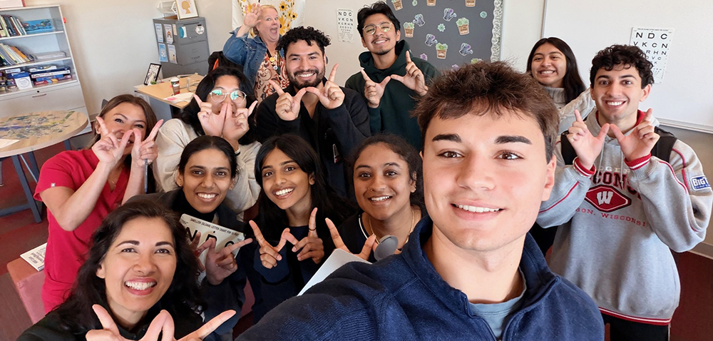 group doing a selfie for the camera