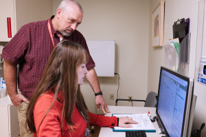 CERU's Matt Gilles and Bonnie Verges review participant data