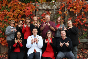 Team CERU signs the "W" for UW-Madison