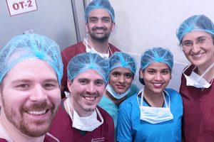 Group photo of UW senior residents with consultants and staff at Dr. Shroff's Charity Eye Hospital, in India. 